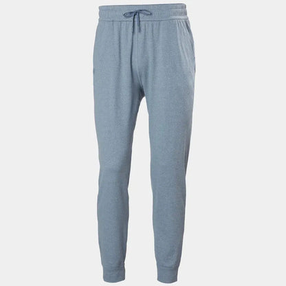 Side view of the Helly Hansen Men's Tyri Knit Joggers in Washed Navy showing the drawstring waist and cuffed ankles against a plain white background.