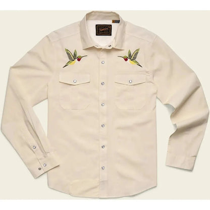A front view of the Howler Brothers Men's Gaucho Snapshirt in Enter The Dragons color showing embroidered hummingbirds on the chest and buttoned cuffs.