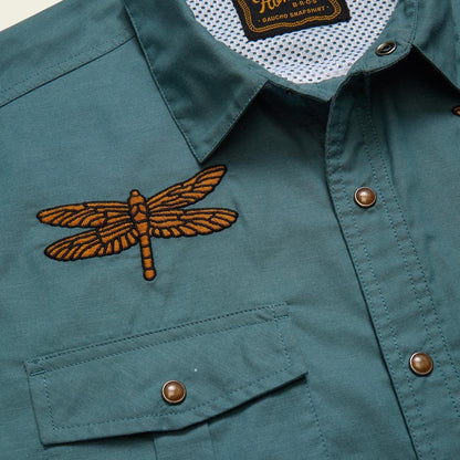 A close up of the Howler Brothers Men's Gaucho Snapshirt in Enter The Dragons showing the dragonfly embroidery on the chest pocket.
