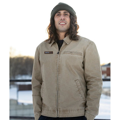 Front view of the Jetty Bradley Canvas Jacket in Brown with a model wearing it against a snowy outdoor background.