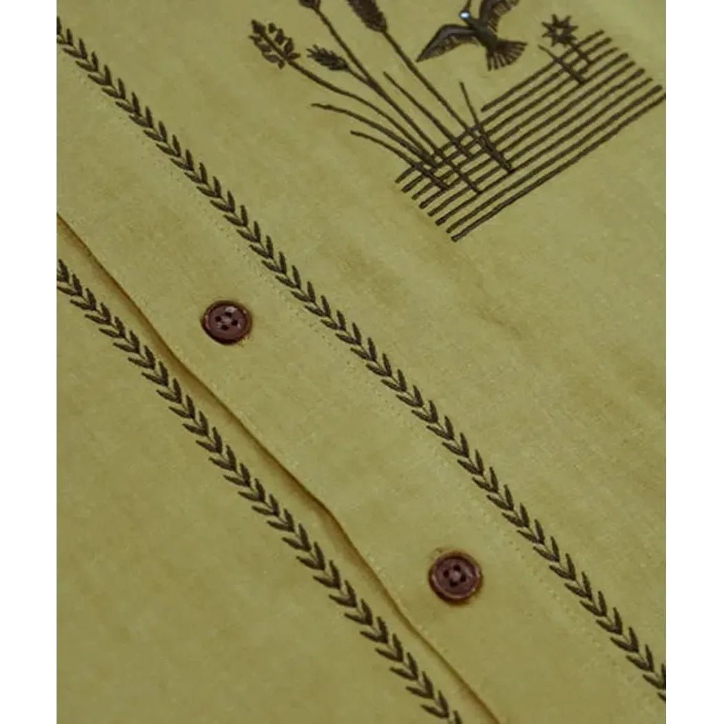 A close-up of the Jetty Men's Marshall Embroidered Linen Shirt in Olive showing the buttons and embroidery against a neutral background.