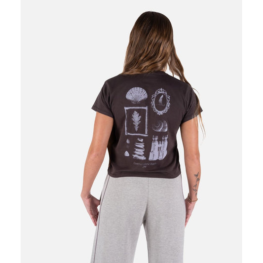 Back view of the Jetty The Search Short Sleeve Tee in Black showing the graphic print on the model wearing it.