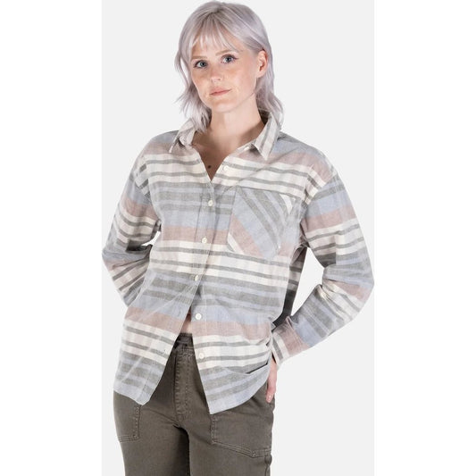 Front view of the Jetty Womens Alpine Corduroy Shirt in Ivory showing a model wearing it with hands in pockets against a white background.