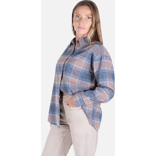 Side view of the Jetty Womens Wander Flannel in Brown showing a model wearing it with hands in pockets against a white background.