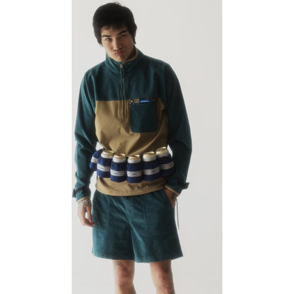Model wearing the Kavu Beer Buddy in Park Lines with six cans attached, standing against a plain white background.