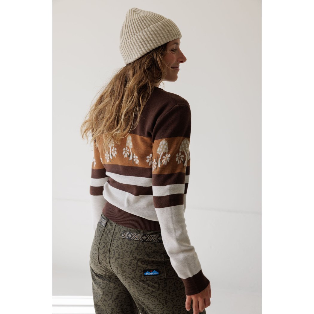Back view of the Kavu Hillrose in Forage Patch worn by a model with a beige beanie against a white background.