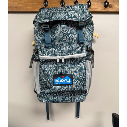 A front view of the Kavu Timaru backpack in Forest Pass hanging on a wall hook.