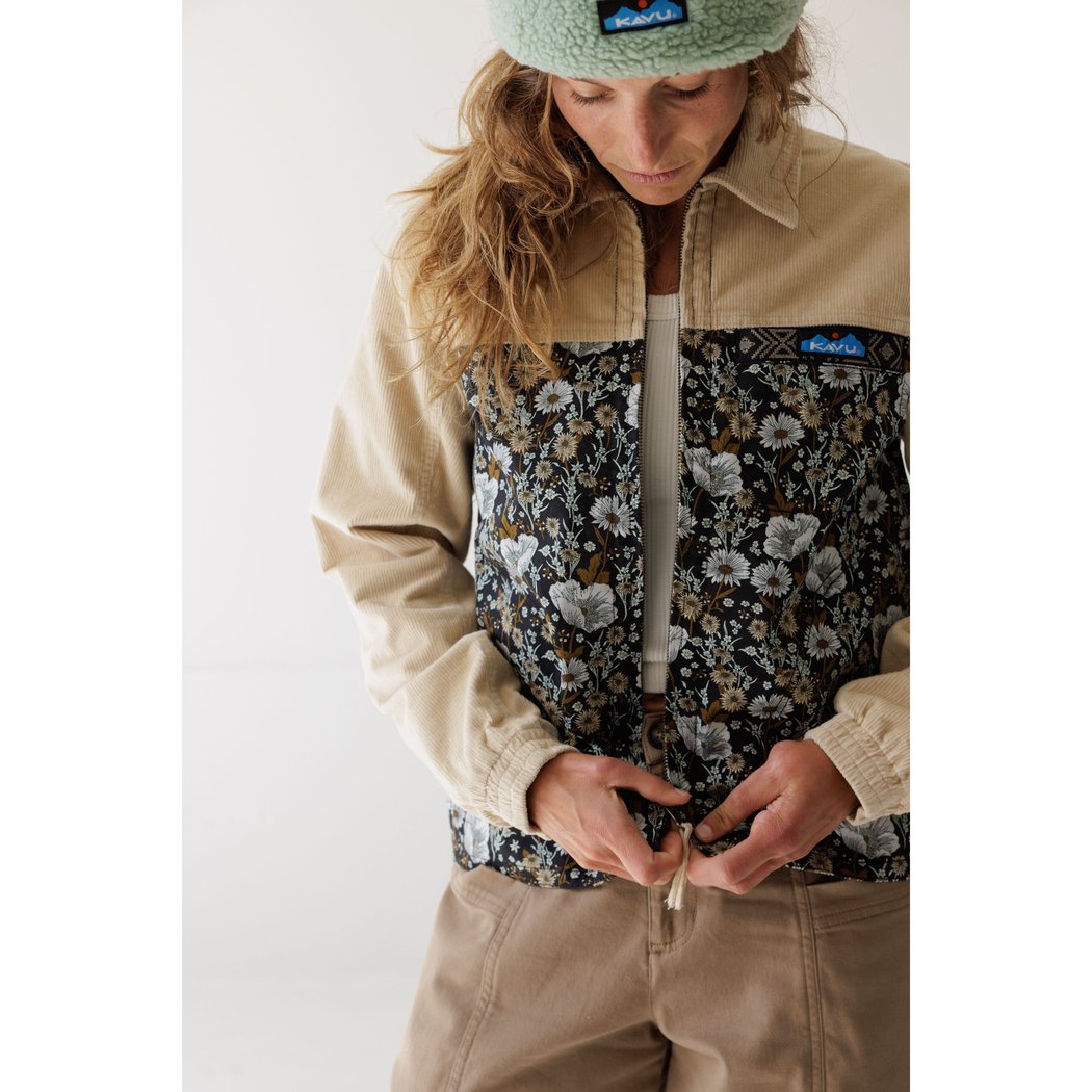 Front view of the Kavu West Haven in Wildflower Hike with a model adjusting the zipper against a white background.