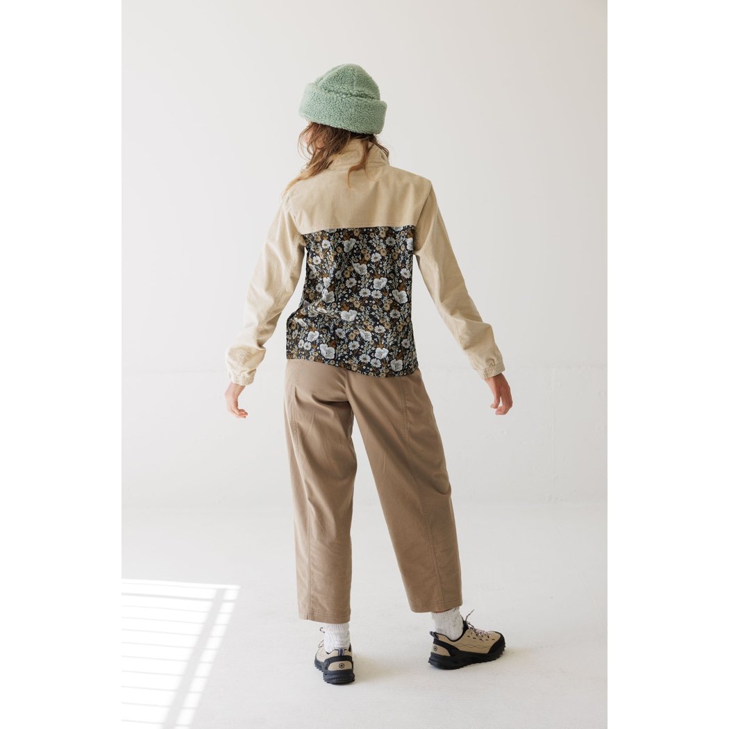 Back view of the Kavu West Haven in Wildflower Hike showing the floral panel and beige sleeves against a white background.