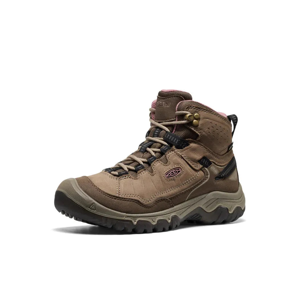 A side view of the Keen Women's Targhee IV Waterproof Hiking Boot in Brindle/Nostalgia Rose with a lugged outsole against a white background.