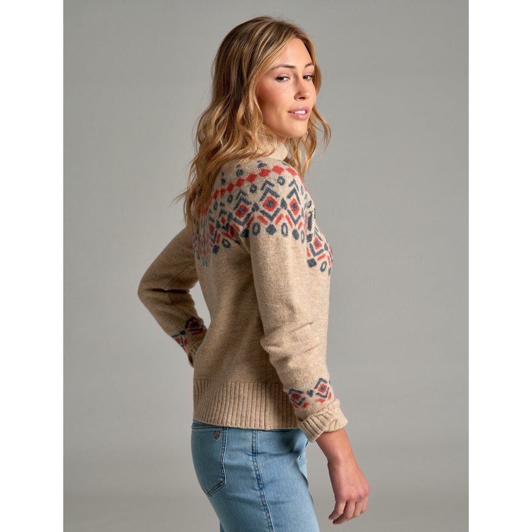 Side view of the Kuhl Alpina Sweater in NATURAL showing the patterned shoulder and sleeve details on a model against a gray background.