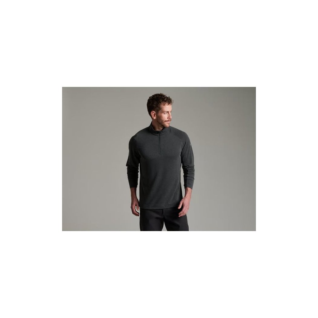 Model wearing the Kuhl Mens Influx 1/4 Zip in Carbon against a plain gray background.