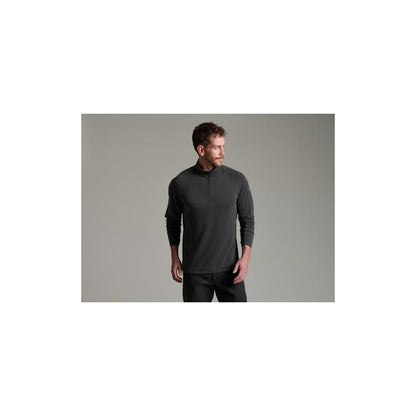 Model wearing the Kuhl Mens Influx 1/4 Zip in Carbon against a plain gray background.