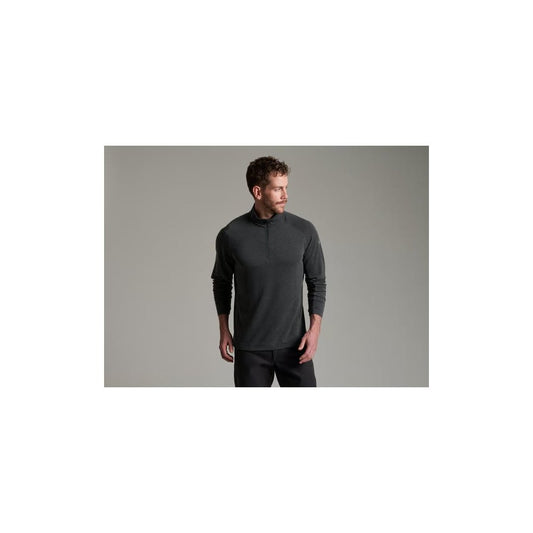 Model wearing the Kuhl Mens Influx 1/4 Zip in Carbon against a plain gray background.