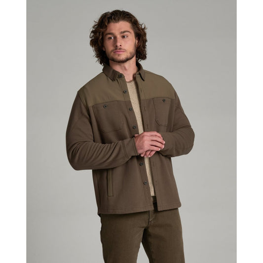 Front view of the Kuhl Relentr™ Shirt-Jac in Kanteen on a man with curly hair against a gray background.