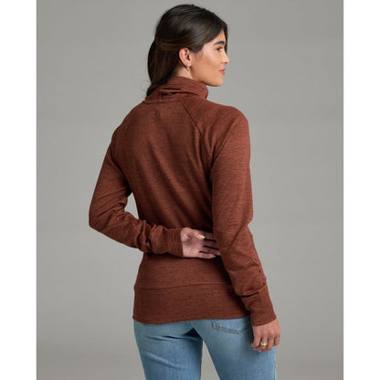 Back view of the Kuhl Women's Elia Pullover in Coffee, model wearing it with light blue jeans against a gray background.