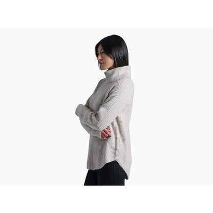 Side view of the Kuhl Women's Sienna Sweater in Cherrywood showing the turtleneck and model wearing it against a white background.