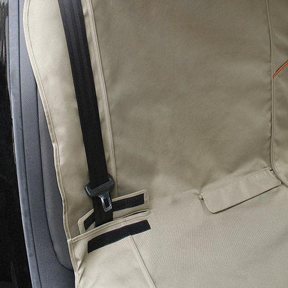 A close-up of the Kurgo Wander Bench Seat Cover in Black, showing the seatbelt attachment and pocket detail.