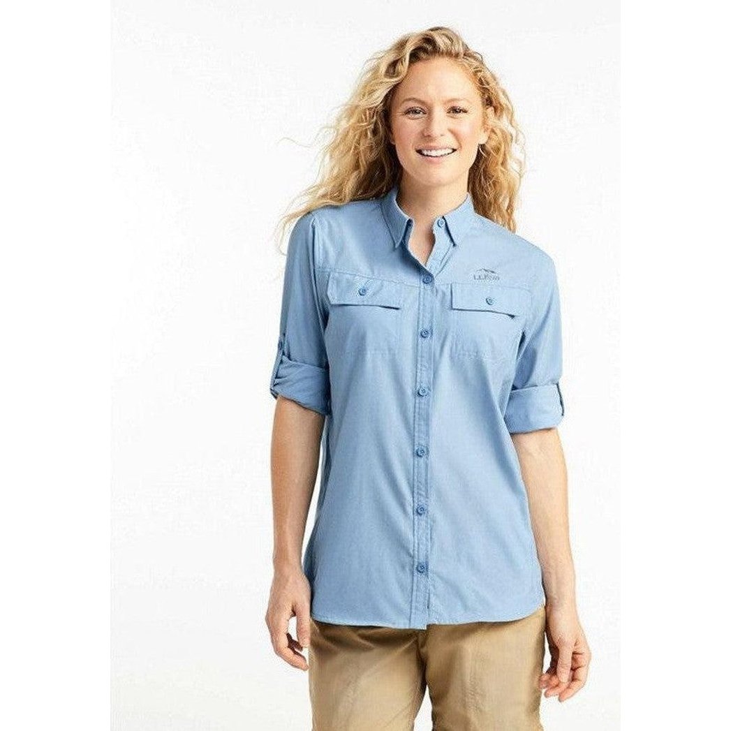 A woman wearing the L.L.Bean Women's Regular No Fly Zone Shirt Long-Sleeve in Blue Aster stands against a white background.