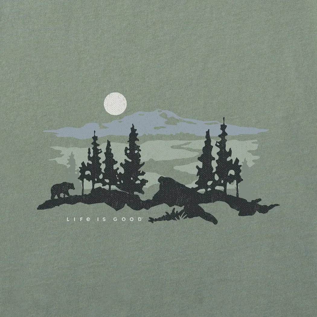A silhouette of a bear and trees with a moon and mountains on a moss green tee that says "Life is Good".