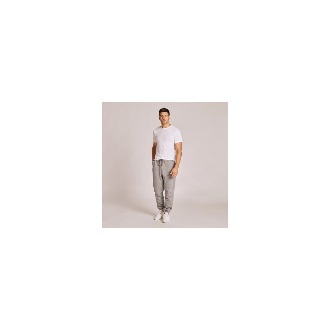A model wearing the Life is Good Men's Solid Good Vibes Jogger in Heather Gray stands against a light gray background.