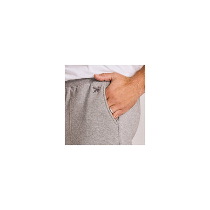 Side view of the Life is Good Men's Solid Good Vibes Jogger in Heather Gray showing the pocket and a hand in the pocket.