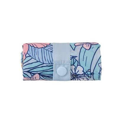 A front view of the Life is Good Tropical Floral Pattern Roll and Go Tote in Darkest Blue showing the snap closure against a white background.