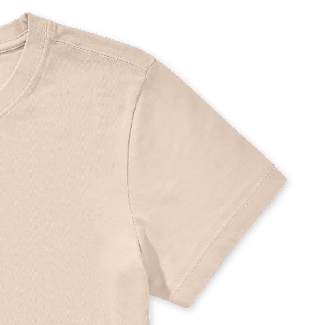 A close-up of the Life is Good Women's Collection of Mushrooms Short Sleeve Crusher Tee in Birch White showing the collar and sleeve seam against a white background.