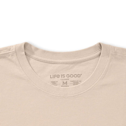 A close-up of the Life is Good Women's Florowl Moon Short Sleeve Crusher Tee in Birch White showing the collar and tag against a white background.