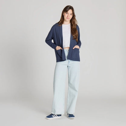 A model wearing the Life is Good Women's Solid Soft Touch Open Cardigan in Inkwell Blue stands against a plain background.