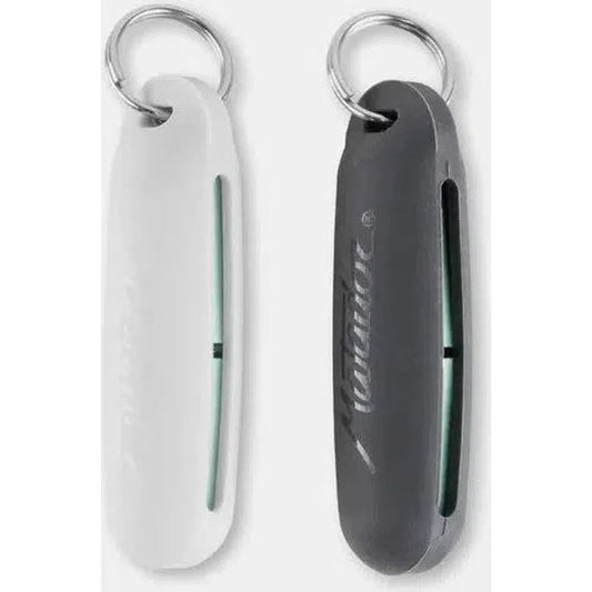Two Matador Travel Earplugs Kits in white and charcoal hang from keyrings, side by side against a white background.