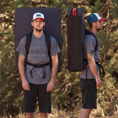 Two views of a man wearing the Metolius Session II Crash Pad in Black/Gray, showing front and side angles against a forest background.