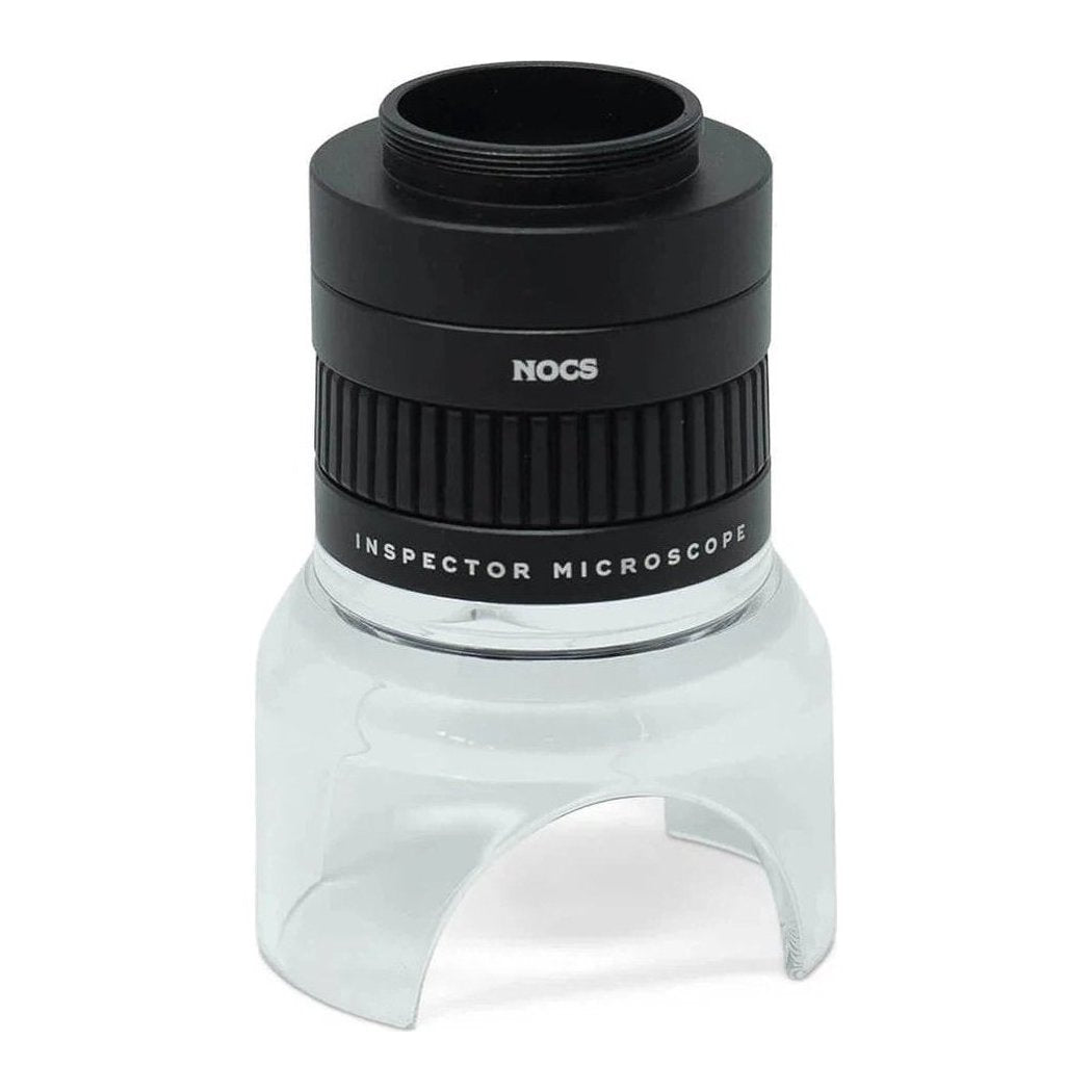 A front view of the Nocs Provisions 8x32 Monocular Bundle in Juniper Green with a black top ring and clear base against a white background.