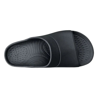 A top-down view of the NuuSol Men's Sawtooth Slide in Eclipse Black, showing the textured footbed and strap design against a white background.