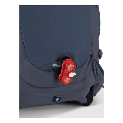 Side view of the Osprey Mira 32 in Anchor Blue showing the red light feature on the front pocket.