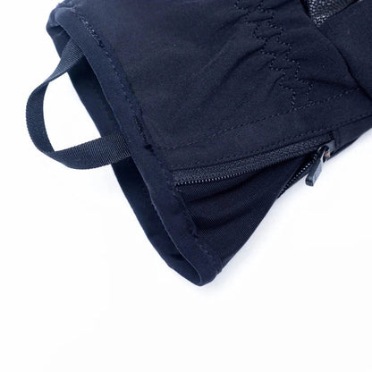 A close-up of the Outdoor Research Men's Stormtracker Sensor Windbloc Gloves in Black, showing the zipper and strap on a white background.