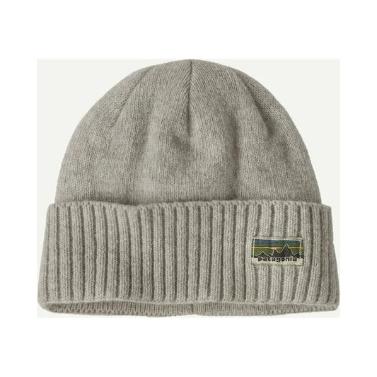 A front view of the Patagonia Brodeo Beanie in Talon Gold with a ribbed cuff and a logo patch on the front, against a white background.
