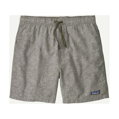 Side view of the Patagonia Men's Baggies Naturals in Feather Grey showing the drawstring waist and small logo patch on the lower right leg.