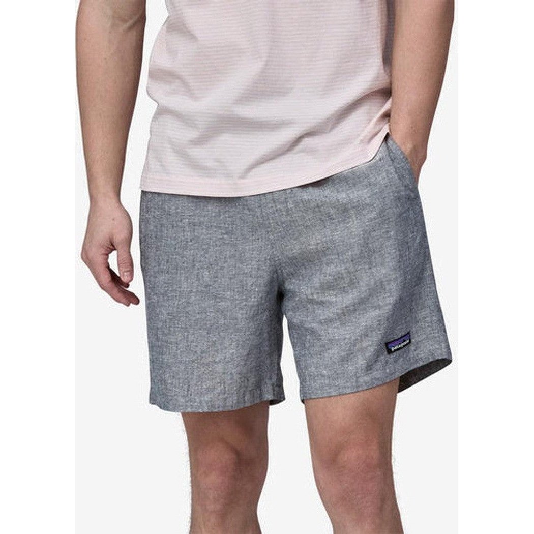 Side view of the Patagonia Men's Baggies Naturals in Chambray: Feather Grey showing the small logo on the right leg against a plain white background.
