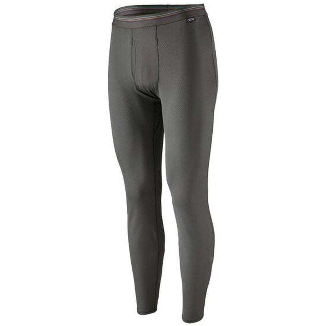 Side view of the Patagonia Men's Capilene Midweight Bottoms in Black against a white background.