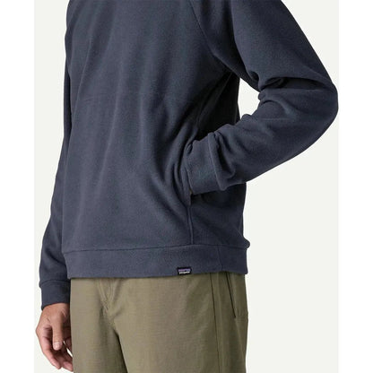 Side view of the Patagonia Men's Micro D Crewneck in Basin Green showing the model wearing it against a plain background.