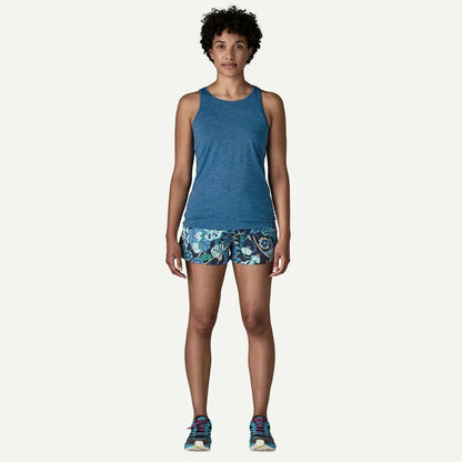 A front view of the Patagonia Women's Cap Cool Daily Tank in Aquatic Blue - Light Aquatic Blue X-Dye on a model against a white background.