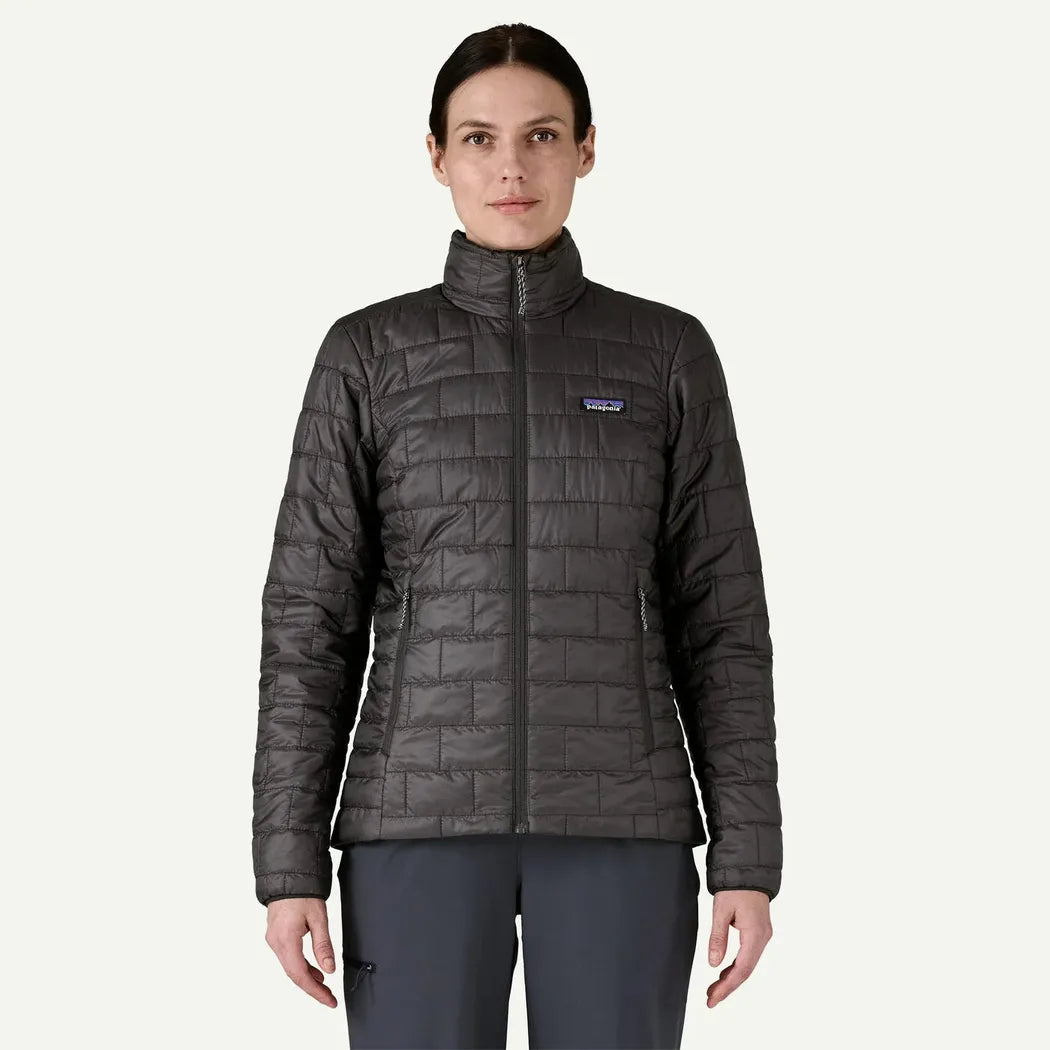 A front view of the Patagonia Women's Nano Puff Jacket in Black on a model against a plain white background.