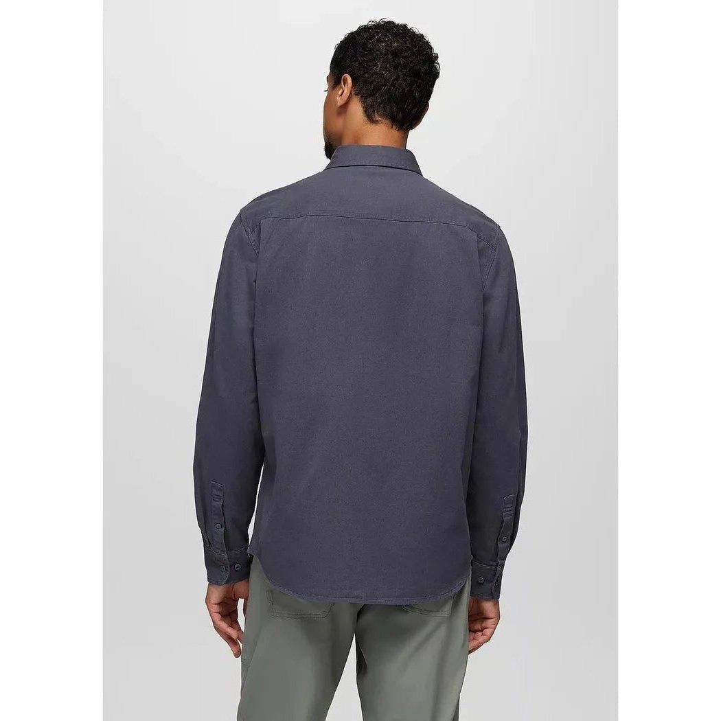 Back view of the Prana Men's Arbored Long Sleeve Shirt in Thundercloud on a model wearing gray pants against a plain background.