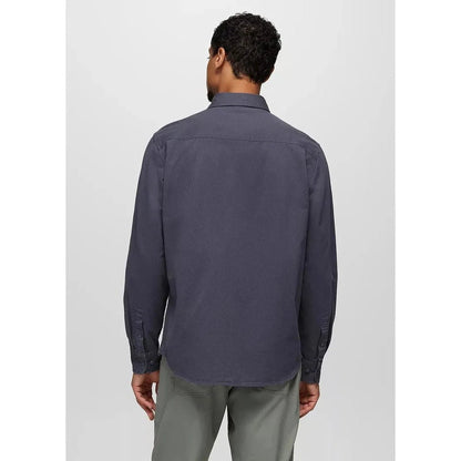 Back view of the Prana Men's Arbored Long Sleeve Shirt in Thundercloud on a model wearing gray pants against a plain background.