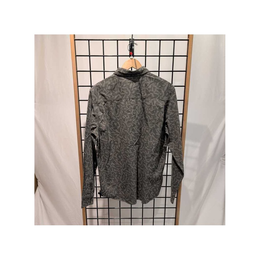 Back view of the Prana Mens Arbored LS Shirt-SAMPLE in Nori Freestyle hanging on a grid wall with a wooden hanger.