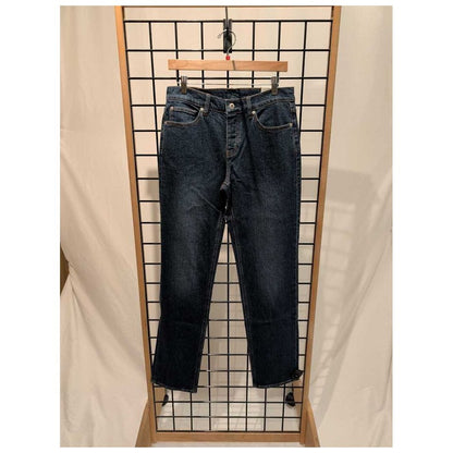 Front view of the Prana Mens Carlsbad 760 Standard Jean-SAMPLE in Lagoon/32 hanging on a grid display with a wooden hanger.