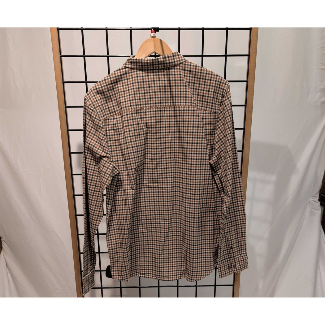 Back view of the Prana Mens Dolberg Flannel-SAMPLE in Tawny hanging on a grid display with a white backdrop.