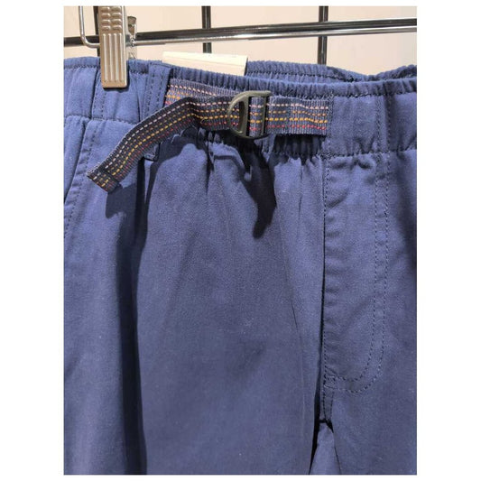 Close-up of the Prana Mens Durado Pant-SAMPLE in Capulet Blue showing the elastic waistband and belt loop with a metal clip on a grid background.
