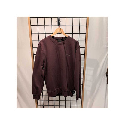 Front view of the Prana Mens Everyday Crew Sweatshirt-SAMPLE in DeepVino hanging on a wooden hanger against a grid backdrop.